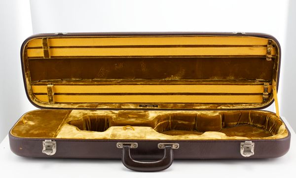 A violin case, branded Jaeger