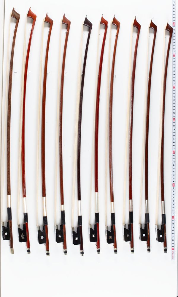 A bundle of ten cello bows, varying sizes