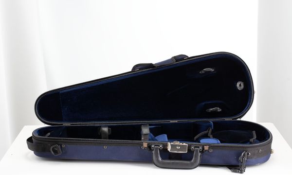 A bundle of three violin cases
