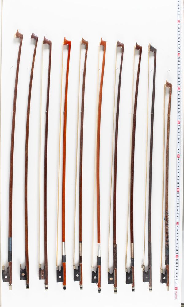 A bundle of twenty-two bows and three bow sticks, varying lengths