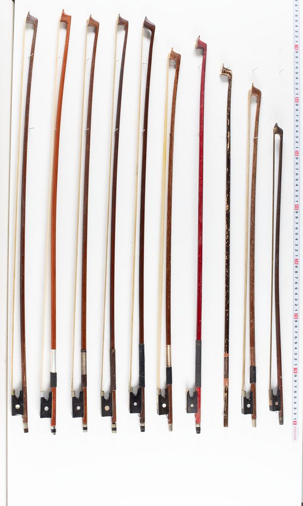 A bundle of nineteen bows and one bow stick, varying sizes