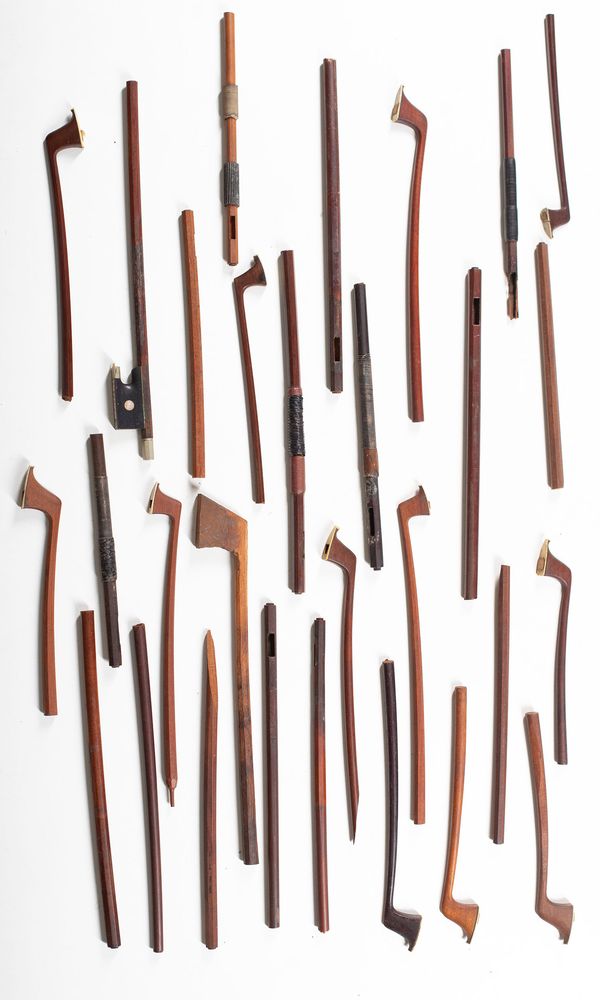 A bundle of mismatched broken bow halves, varying sizes