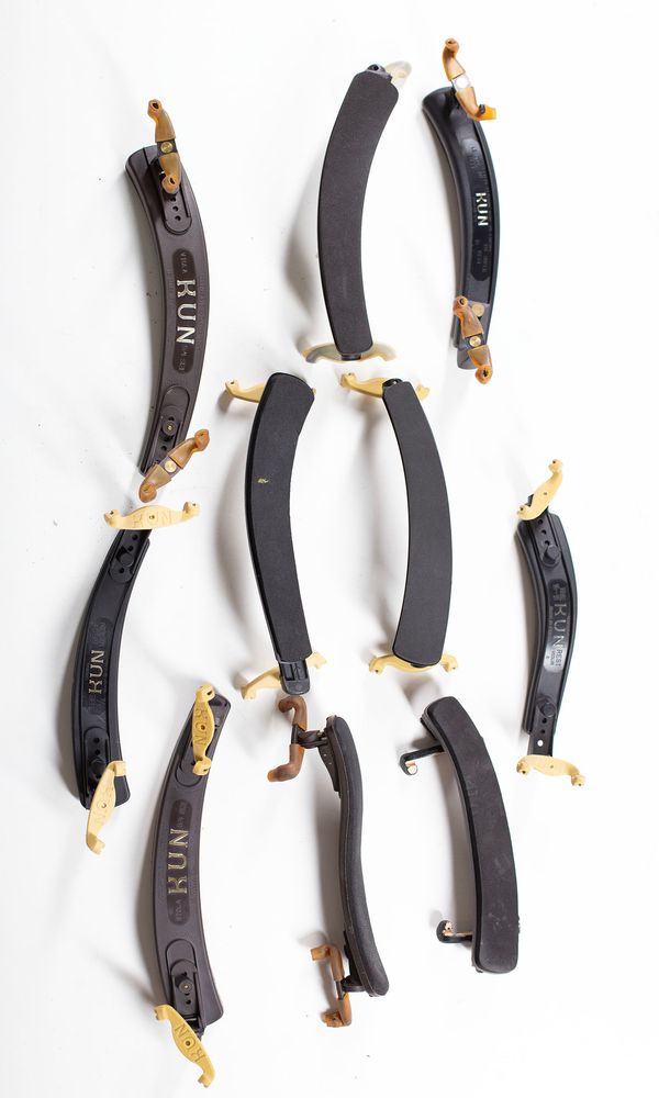 A bundle of ten shoulder rests, varying sizes