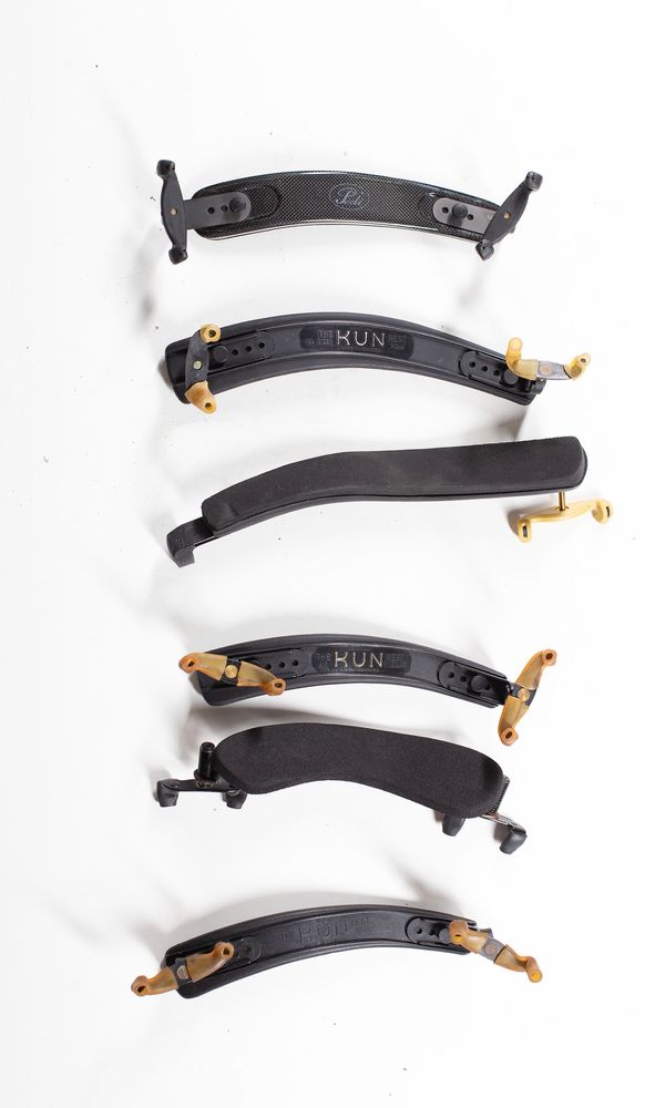 A bundle of ten shoulder rests, varying sizes