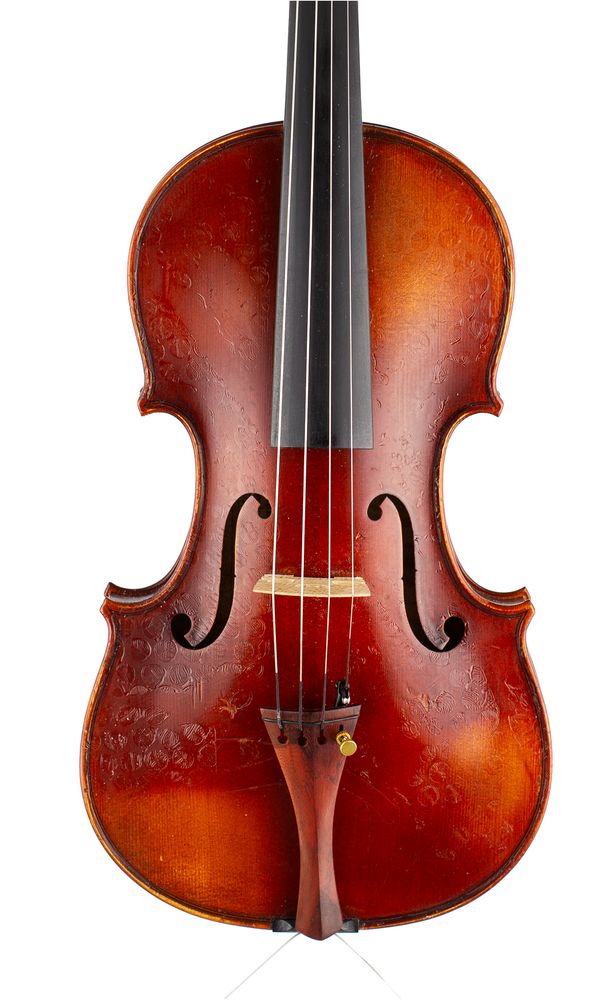 A violin, labelled Caressa & Francais