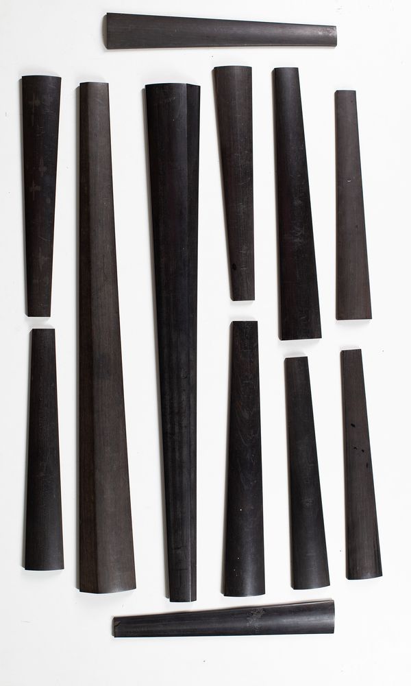 Ten violin fingerboards and two cello fingerboards
