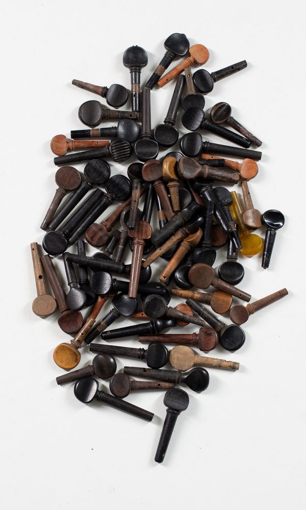 Sixty-eight mixed violin pegs