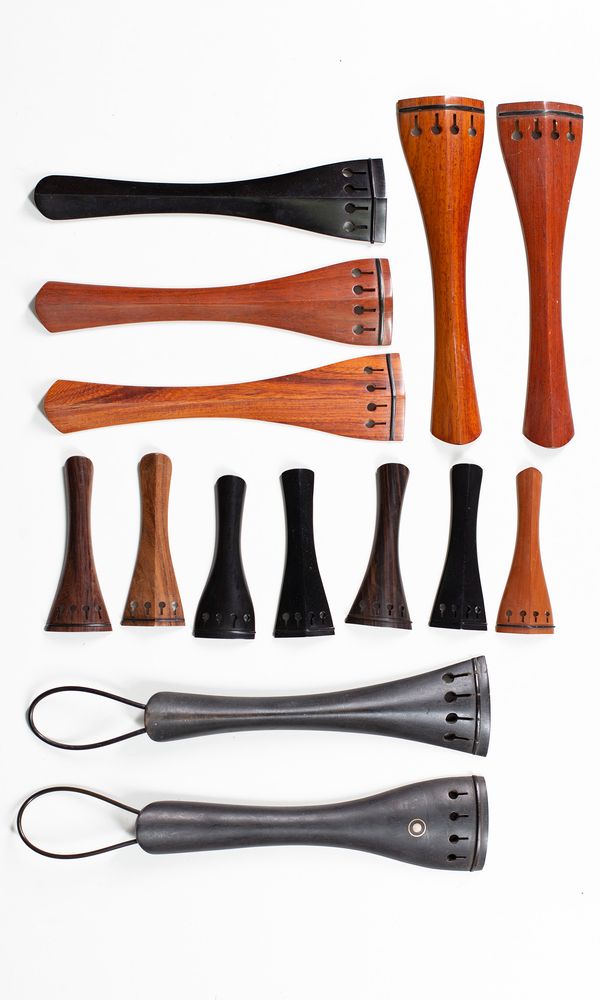 A small quantity of tailpieces and chinrest, various sizes