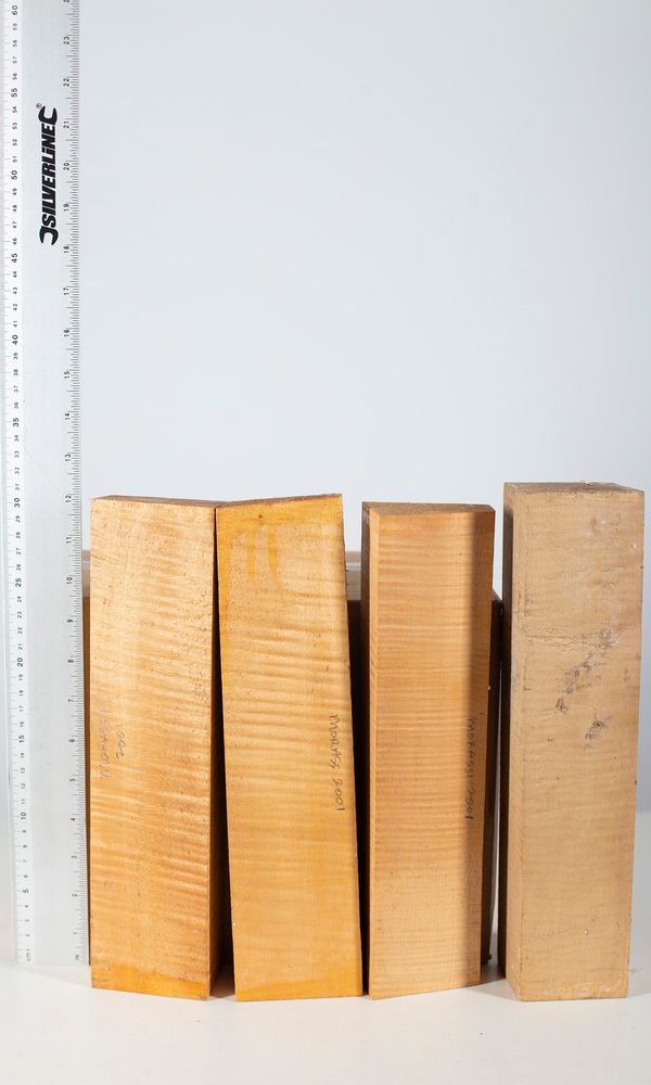 Four violin scroll blocks, maple