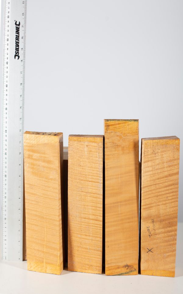 Four violin scroll blocks, maple