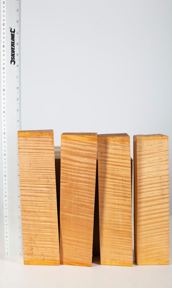 Four violin scroll blocks, maple