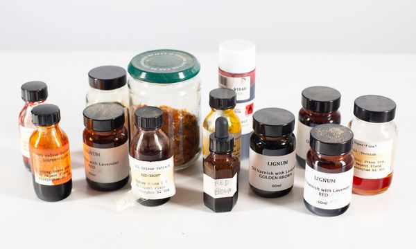 A box of various bottles of varnish