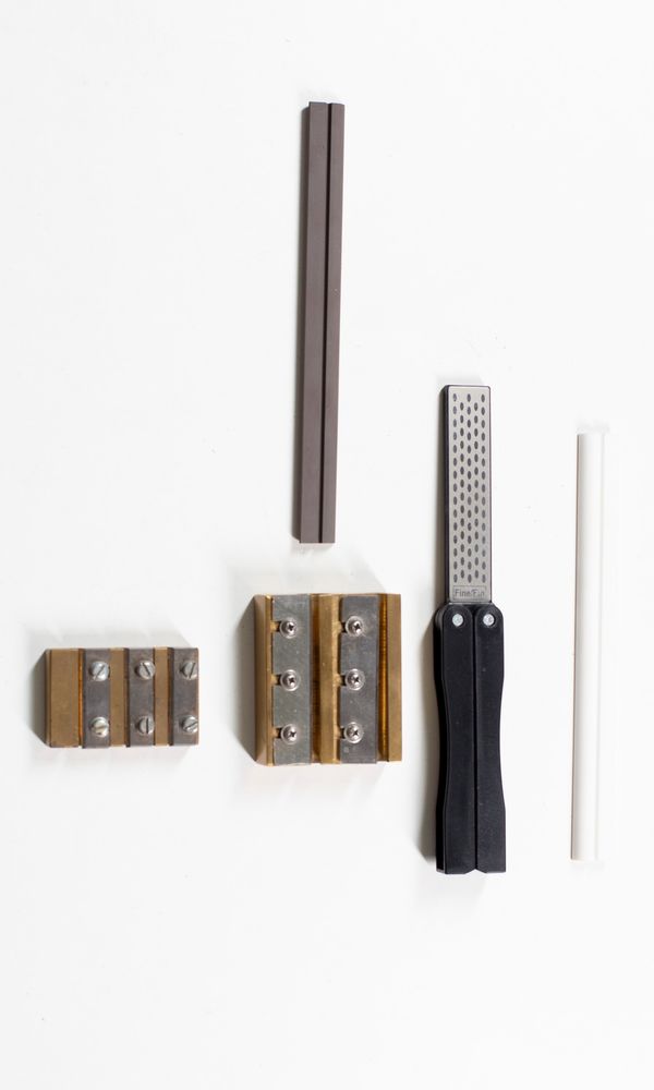 Two peg shavers and two sharpening stones