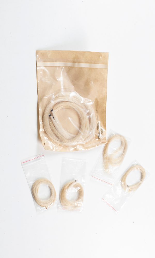 Four hanks of violin bow hair and three hanks of cello bow hair