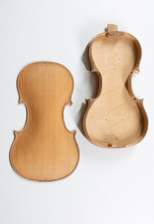 A body of a violin, partially made