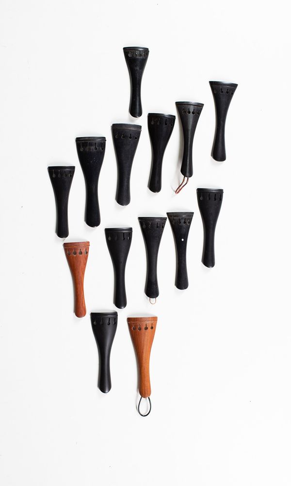 Fourteen violin tailpieces, various sizes