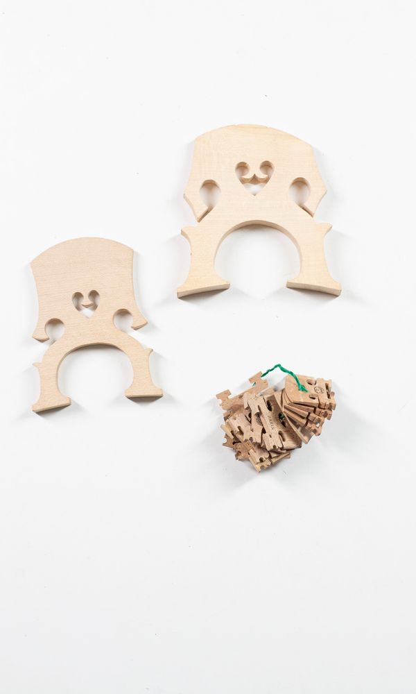 Two bass bridges and fourteen violin bridges