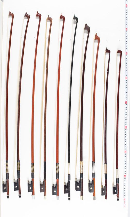 Twenty - tree violin bows and four cello bows, varying lenghts