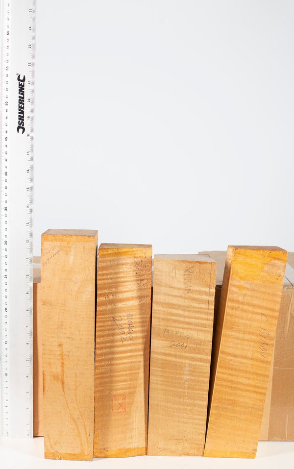 Four violin scroll blocks, maple