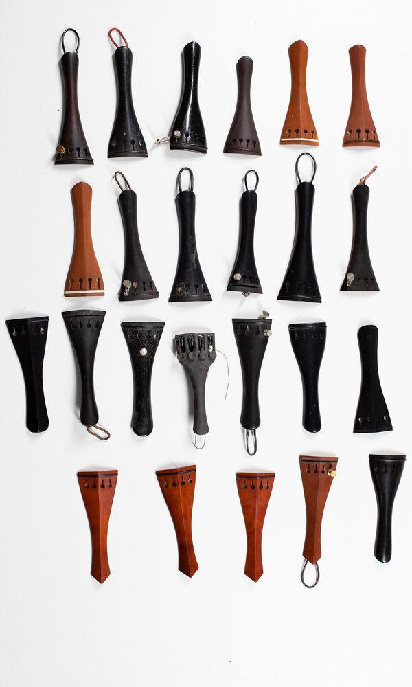 A small quantity of tailpieces and endpins