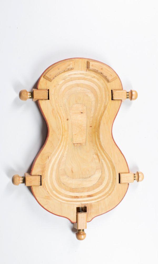 A violin repair and carving cradle