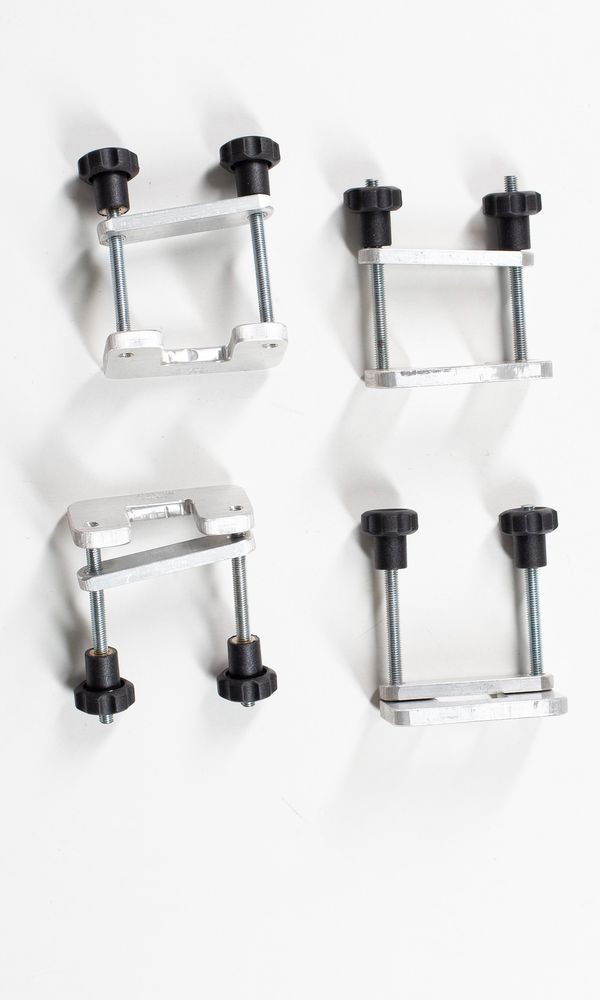 Four violin neck clamps
