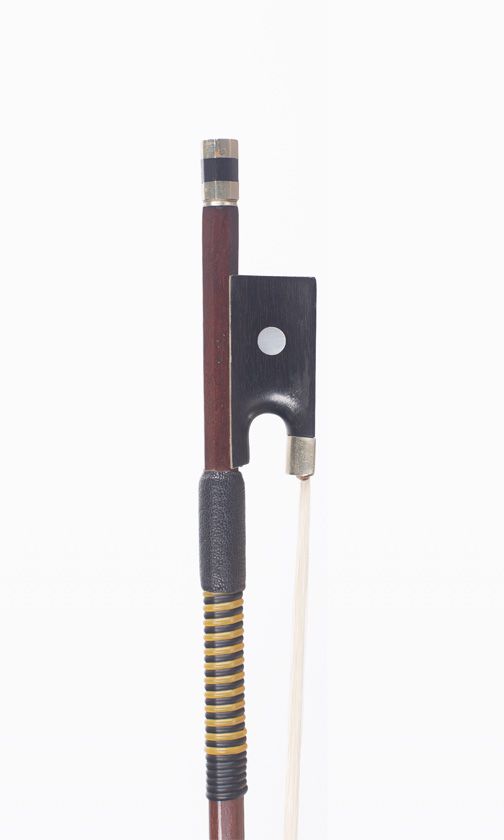 A nickel-mounted violin bow, branded P.C.