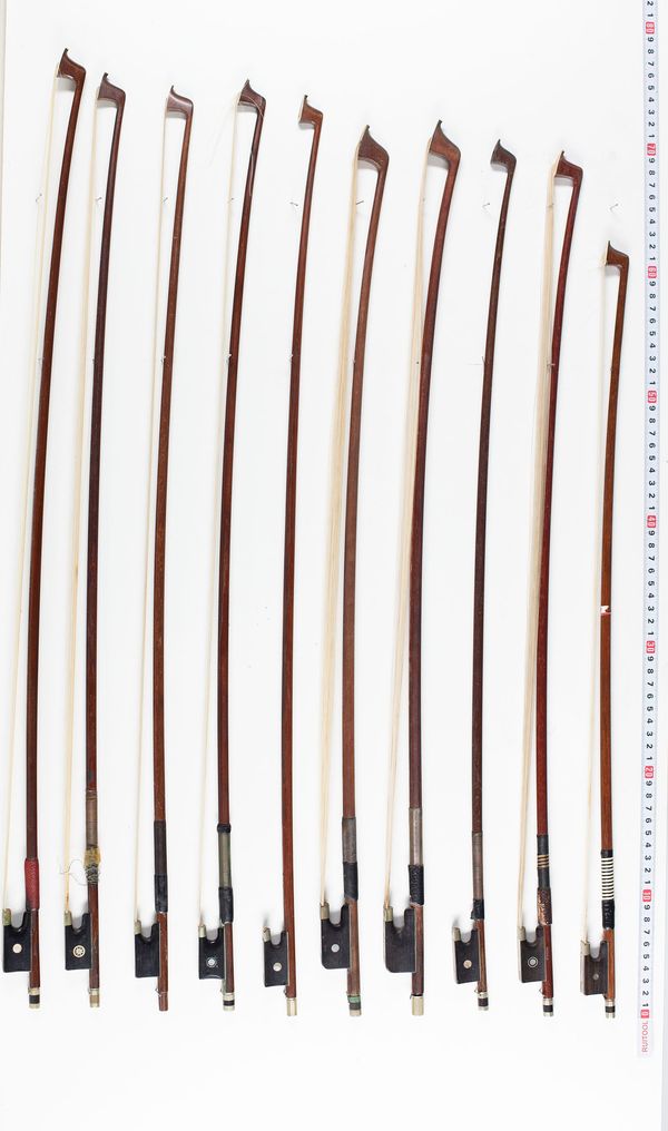 Eight cello bows and seven violin bows, varying lengths