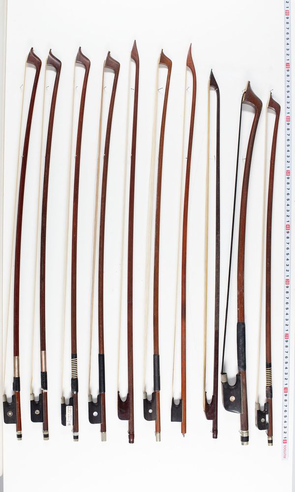 Twelve cello bows, three baroque bows and one double bass bow, varying lengths