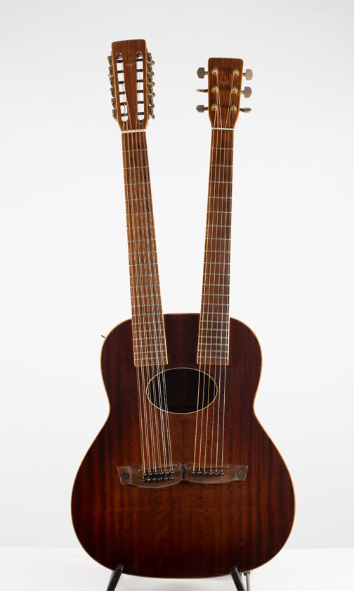 A Daion 80W doubleneck acoustic guitar
