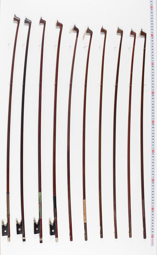 Five violin bows and seven violin sticks, varying lengths