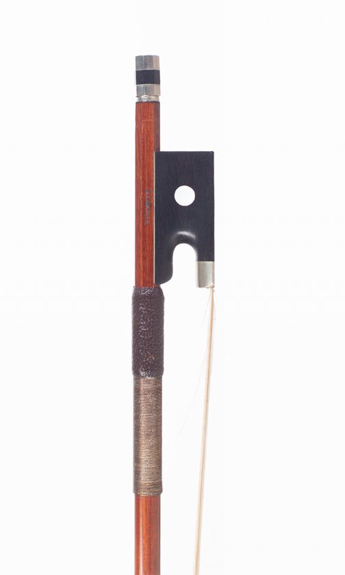 A nickel-mounted violin bow, branded Tourte