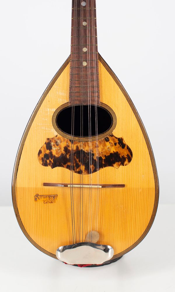 A mandolin, branded Silvestri Catania [on front]