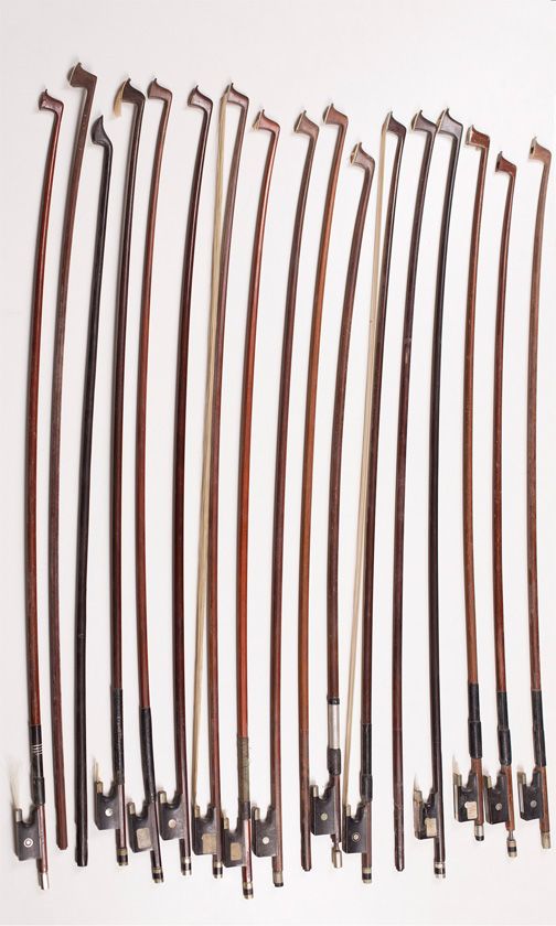 Twelve violin bows and eight child's violin bows