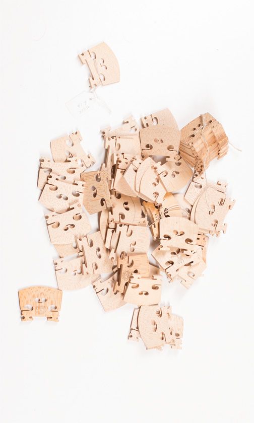 Sixty full size violin bridges