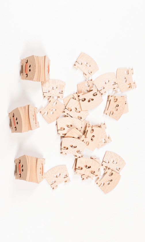 Sixty three-quarter size violin bridges