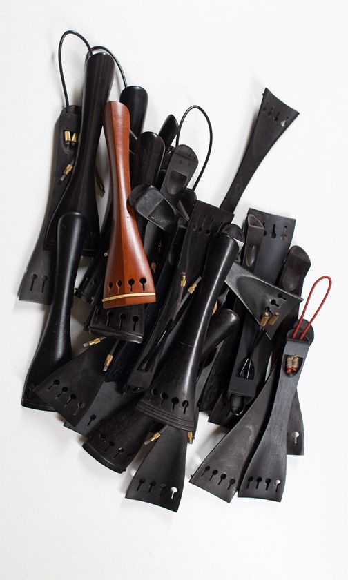 Twenty-nine cello tailpieces