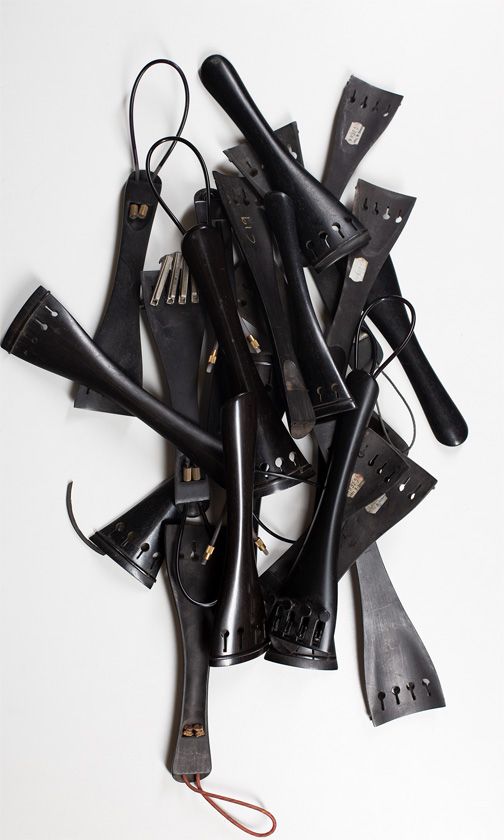 Twenty-two cello tailpieces