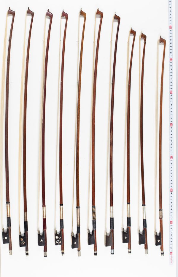 Twenty-two violin bows, varying lengths