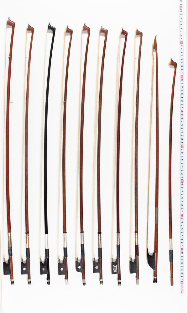 Twenty-one violin bows, one baroque violin bow and one violin stick, varying lengths