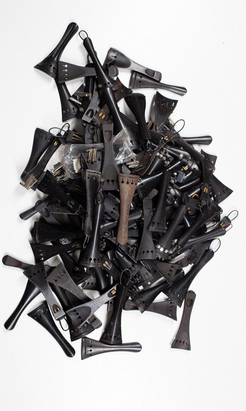 One hundred and twenty-two violin tailpieces of various sizes