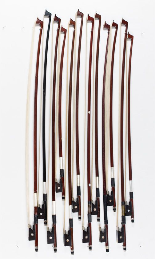 Twelve child's violin bows, various sizes