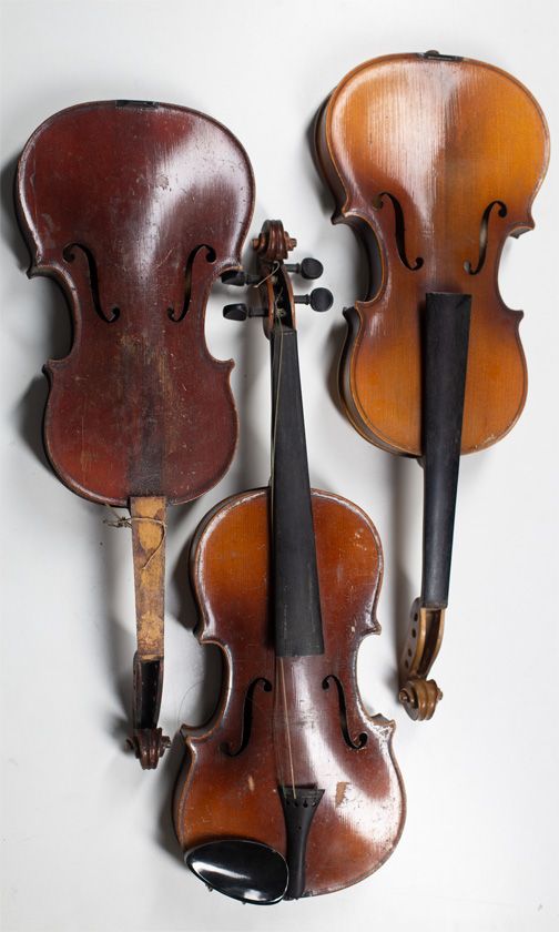 Three child's violins