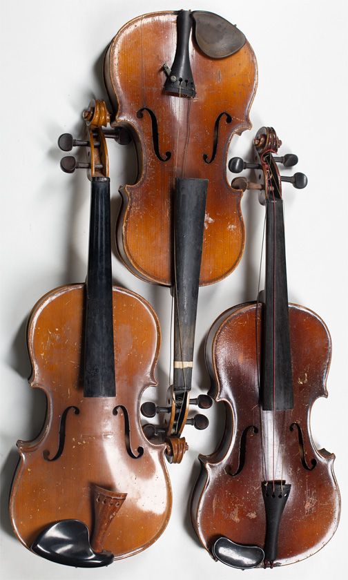 Three child's violins