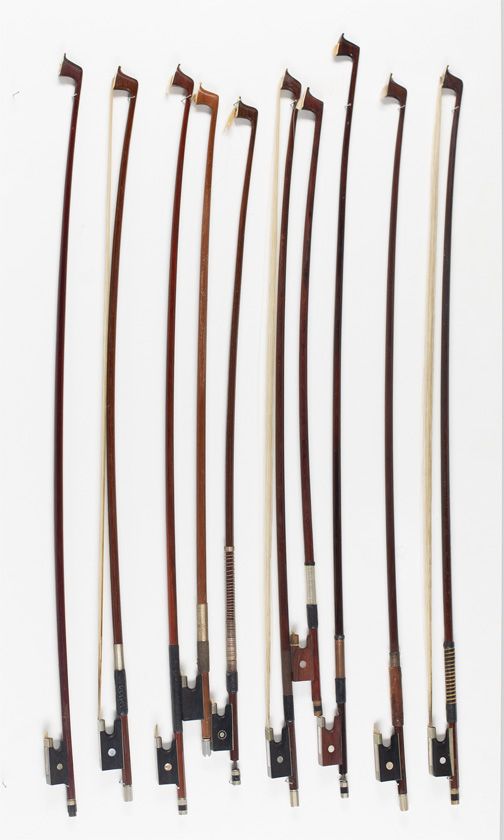 Ten child's violin bows, various sizes