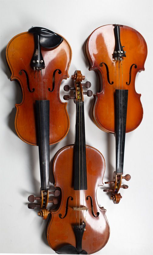 Three child's violins