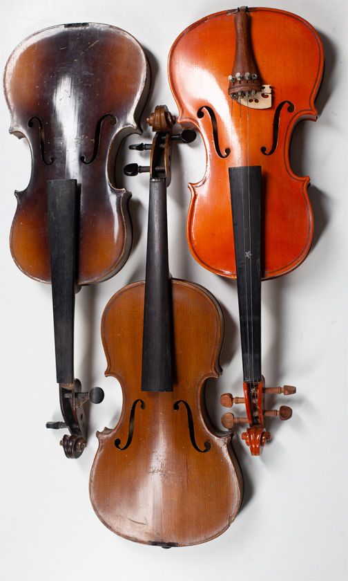 Three child's violins