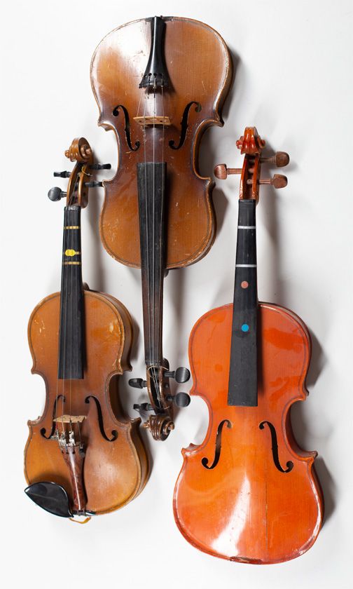 Three child's violins