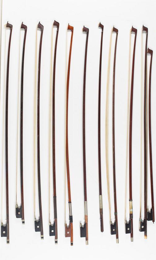 Eighteen violin bows, one child's violin bow and one violin bow stick