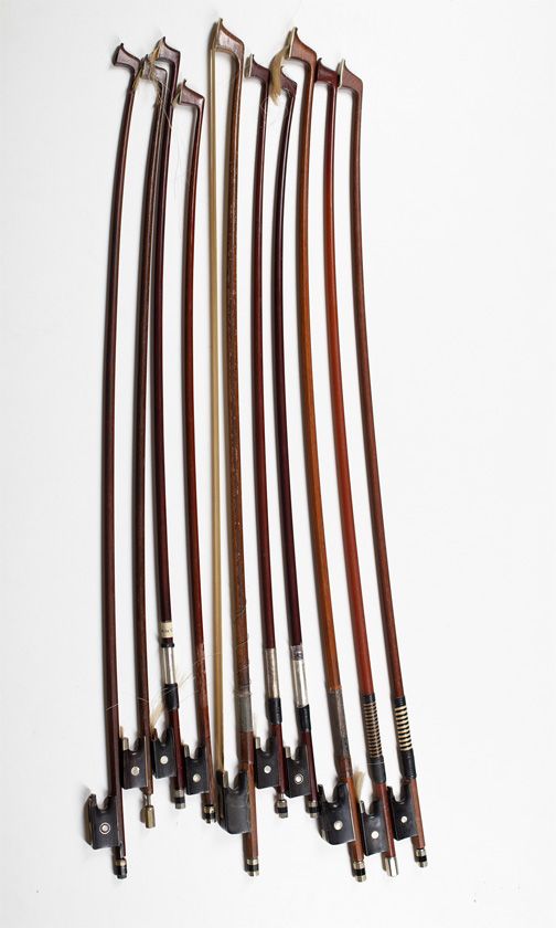 Eight child's violin bows and two cello bows